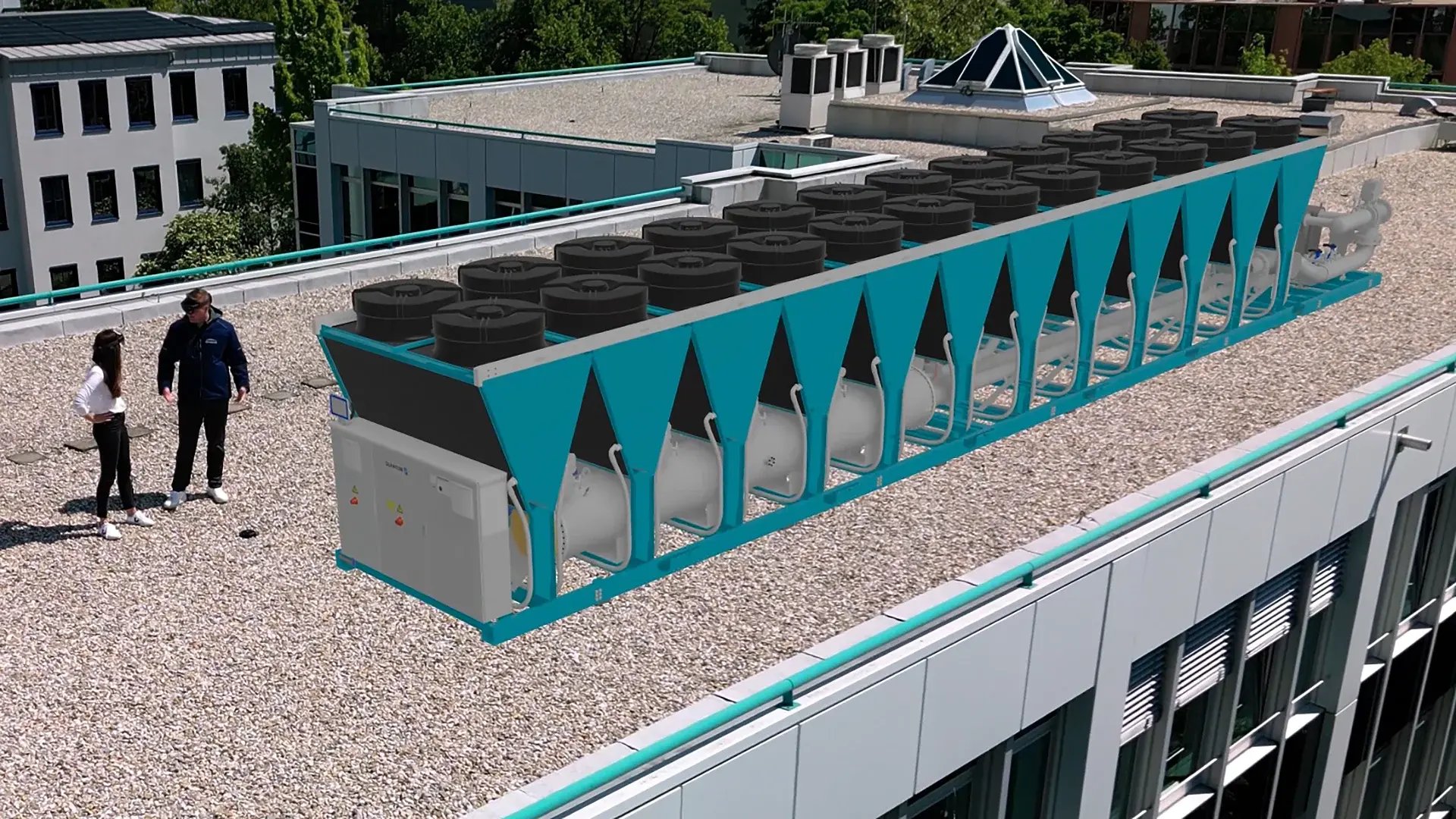 An engineer and customer visualizing a cooling machine on the roof of a building.